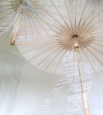 Rising (2018) by Rozanne Hermelyn
Clear umbrellas, fishing line, silkscreen or laser cut on plexi, Installation variable